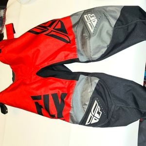 Kids red, black and grey fly racing riding pants, size 20.
